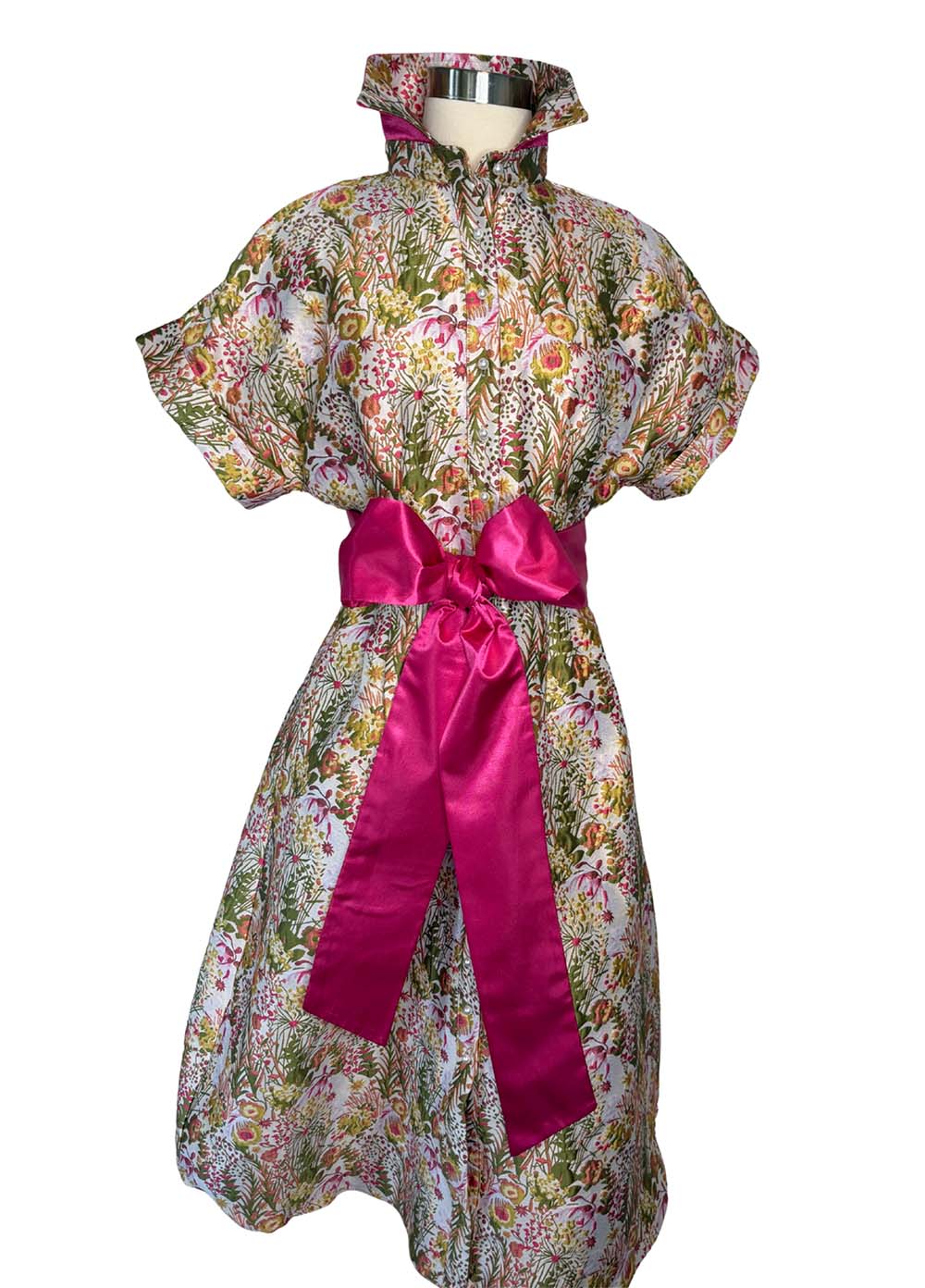 Floral dress with a pink ribbon on a white background